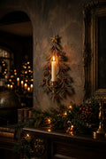 Vintage gold Christmas tree candle holder hanging on a wall