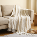 Cream knitted throw blanket with tassels