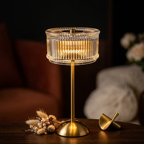 Crystal table lamp close-up with brass accents and dried florals